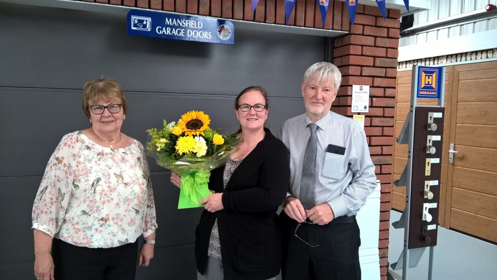 The Mansfield Garage Doors team inside our showroom